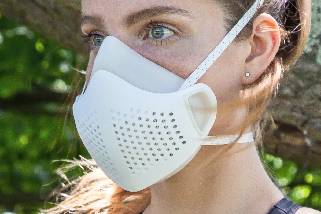 This reusable face mask uses a pleated HEPA filter to let ...