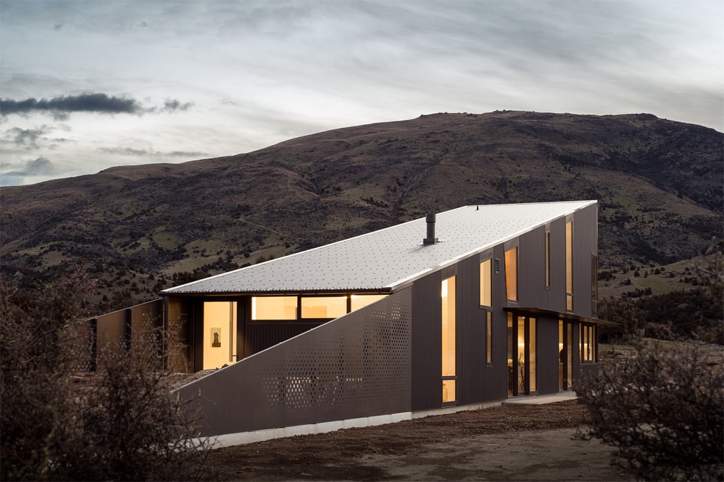 This Wedge shaped Home Features Curved Wood Ceilings And Stone Flooring To Echo New Zealand s