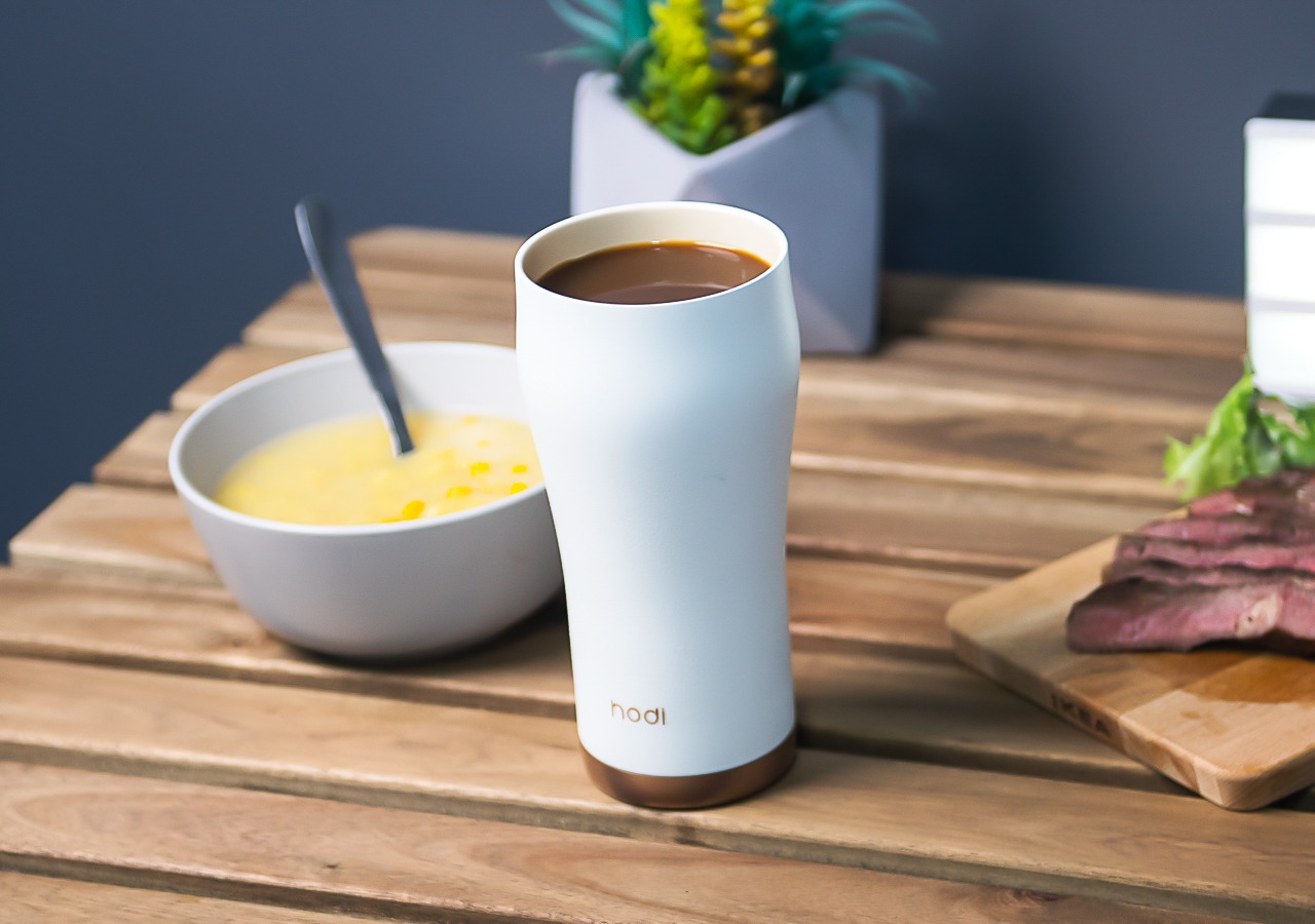 This ceramic tumbler with a removable glass cup retains your drinks  original taste - Yanko Design