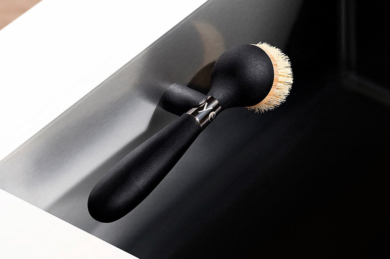 https://www.yankodesign.com/images/design_news/2021/12/this-sleek-soap-dispensing-dish-brush-could-easily-be-the-most-beautiful-product-in-your-entire-kitchen/magnetic_dish_brush_conveniently_hides_in_the_sink_hero.jpg