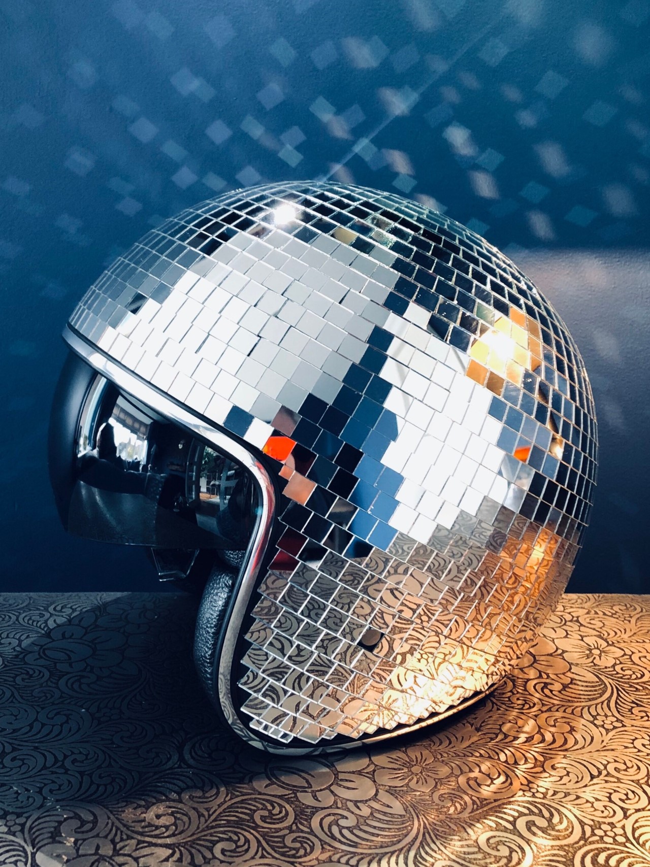 https://www.yankodesign.com/images/design_news/2022/06/this-disco-ball-helmet-may-just-be-a-public-safety-hazard-but-its-easily-the-coolest-riding-accessory-ever/disco_ball_helmet_3.jpg