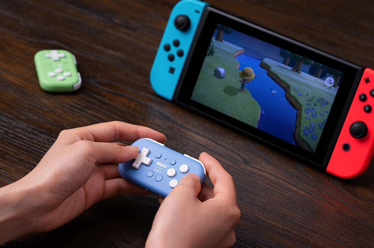 https://www.yankodesign.com/images/design_news/2023/08/bid-adieu-to-clunky-controllers-and-embrace-the-micro-future-of-wireless-gaming-convenience/8BitDo-Micro-Controller-4.jpg