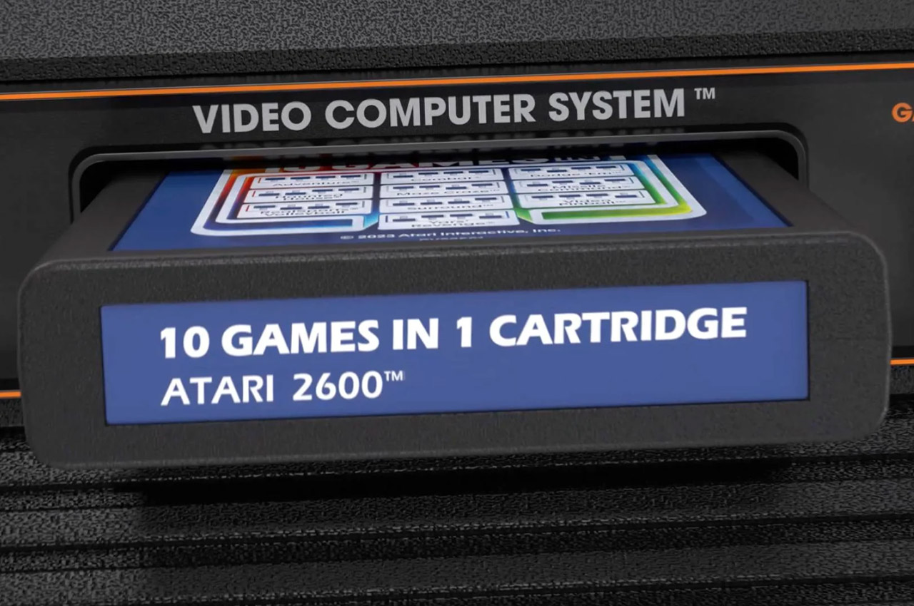 Retro-modern Atari 2600+ console plays classic game cartridges in