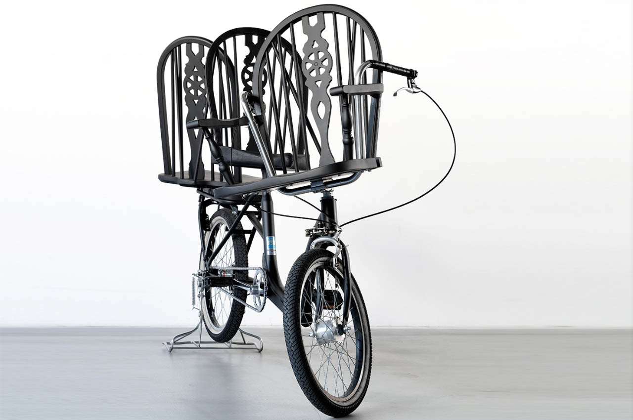 #A bicycle with three embedded chairs to ferry around town … wait , what!