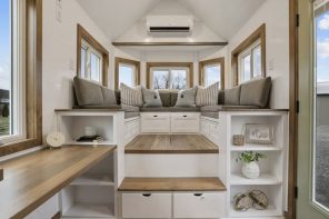 A Raised Living Area With Integrated Storage Makes This Tiny Home More Functional & Unique Than It Looks