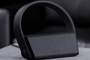 Wireless headphones concept sits on a charger that doubles as a speaker