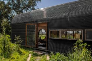 Vaulted Tiny Home Seems To Float Above The Ground, While Seamlessly Merging Indoors & Outdoors