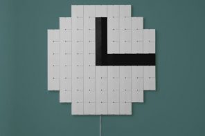 Split-flap mechanical clock puts a dynamic piece of pixel art on your wall